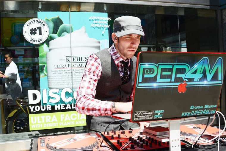 Joe Moser , a/k/a DJ Per4m, was hired by Liberty Place to drown out a group's rantings. DAVID A. WILLIAMS / DAILY NEWS STAFF