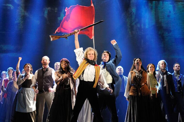 An undated photo provided by the Center Theatre Group shows the cast of Cameron Mackintoshs new 25th anniversary production of Alain Boublil and Claude-Michel Schnbergs Les Misrables. (AP Photo/Center Theatre Group, Deen van Meer)
