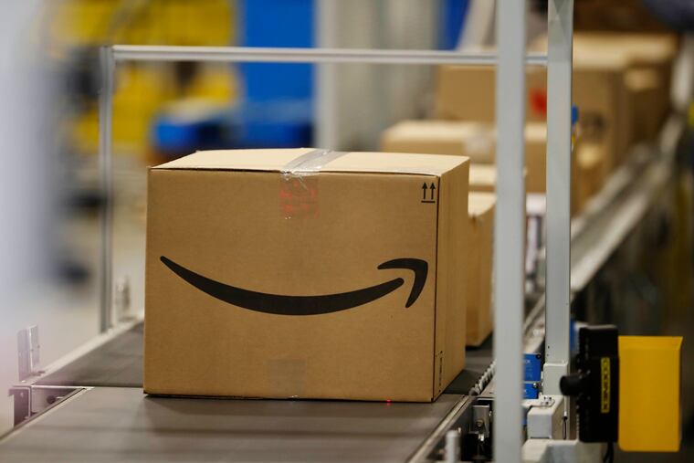 This May 3, 2018, photo shows boxes on a conveyor belt during a tour of the Amazon fulfillment center in Aurora, Colo. The explosion in online shopping has led to porch pirates and stoop surfers swiping holiday packages from unsuspecting residents. The cops in one New Jersey city are trying to catch the thieves with some trickery of their own. (AP Photo/David Zalubowski)