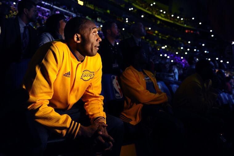 The late Kobe Bryant, shown watching a tribute video at Staples Center before the final game of his career on April 13, 2016.