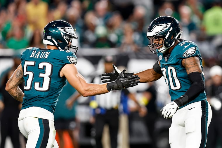 Eagles linebacker Zack Baun (53) celebrates with Jihaad Campbell after breaking up a pass against the Cowboys in 2025.