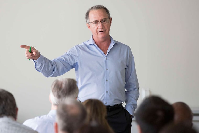 Philadelphia Media Network publisher Terrance C.Z. Egger speaks to employees. He said the Inquirer, Daily News, and Philly.com newsrooms would merge.