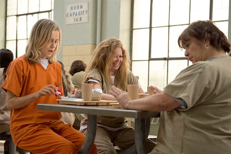 "Orange Ìs the New Black" is amusing to Emmy nominators - the show set in a prison is up for best comedy series. Also nominated: Taylor Schilling (above in orange), for best actress, and Kate Mulgrew, for best supporting actress. (Netflix)