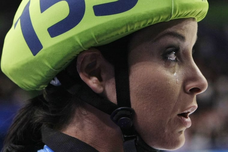 Allison Baver cries as she leaves the ice after their team won the bronze medal for the women’s 3000m relay short track skating competition at the Vancouver 2010 Olympics in Vancouver, British Columbia.