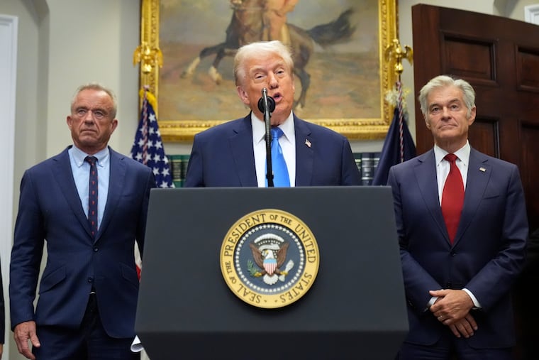 President Donald Trump speaks in the Roosevelt Room of the White House, Monday, Sept. 22, 2025, in Washington, as Health and Human Services Secretary Robert F. Kennedy Jr., left, and Centers for Medicare & Medicaid Services administrator Dr. Mehmet Oz listen.