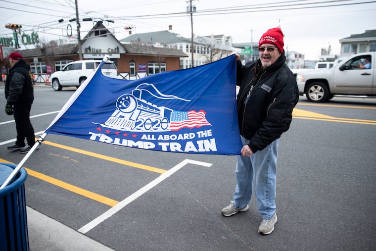 Peter Heller, of Lafayette, shows off his flag while waiting in line for President Donald Trump's visit to Wildwood, at the intersection of Atlantic Avenue and E. Montgomery Ave in Wildwood, New Jersey, on Monday, Jan. 27, 2020. Trump will hold a rally at the Wildwoods Convention Center on Tuesday, Jan. 28.