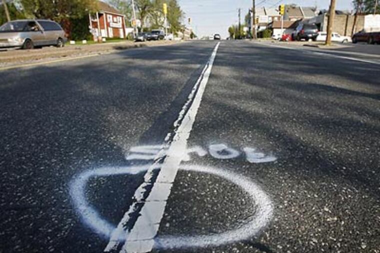 A white circle marks the spot where Cheltenham police found one of two shoes belonging to Tanicha Workman, the 17-year-old girl killed in a hit-and-run accident on Wednesday night. The photograph was taken this morning. (Alejandro A. Alvarez / Staff Photographer)
