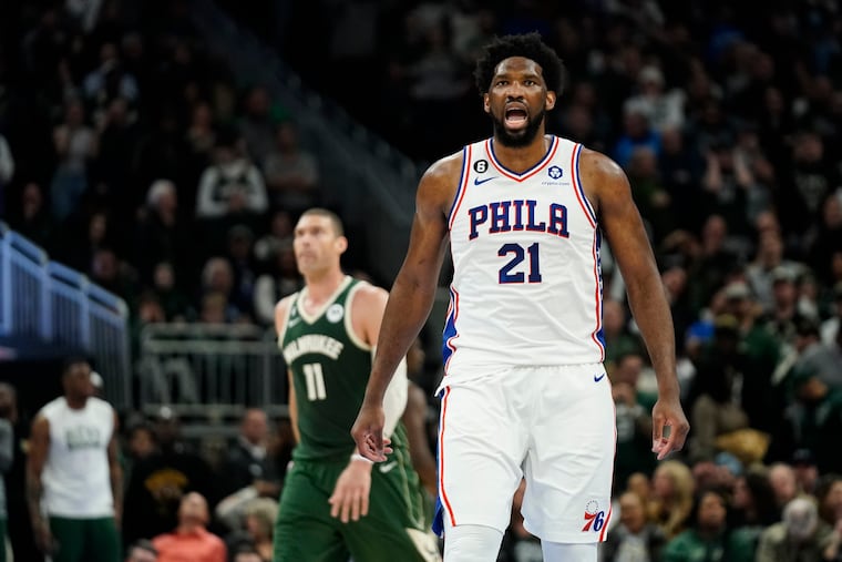 Philadelphia 76ers' Joel Embiid (21) reacts after making a basket during the second half of an NBA basketball game against the Milwaukee Bucks, Saturday, March 4, 2023, in Milwaukee. (AP Photo/Aaron Gash)