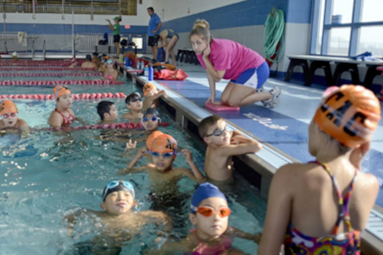 Assistant coach Felicia Santer and charges at Atlantic City High. (Tom Gralish / Staff Photographer)