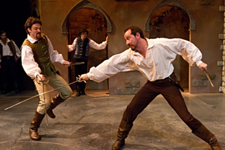 In Lantern Theater Company's “Romeo and Juliet,” swordsmen Jake Blouch (Tybalt) and Charlie DelMarcelle (Mercutio) fight, watched by Sean Lally (Romeo) and Kevin Meehan (Benvolio). (Photo by Mark Garvin)