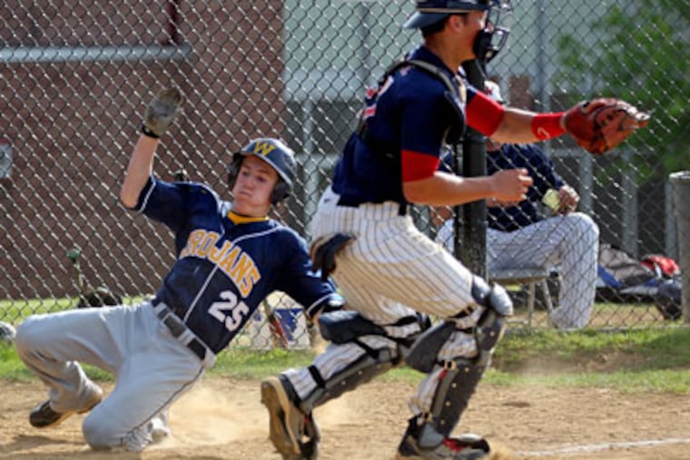 Wissahickon's Greg McDonough slides home before catcher Bobby Slagle can get the throw. (Michael Bryant/ Staff Photographer)