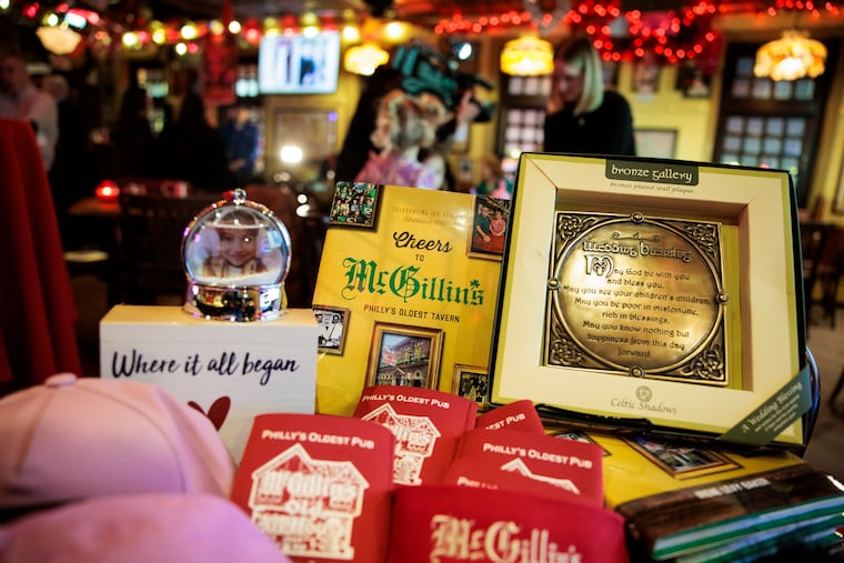 Merch on display at McGillin's, including a snow globe that says "Where it all began."