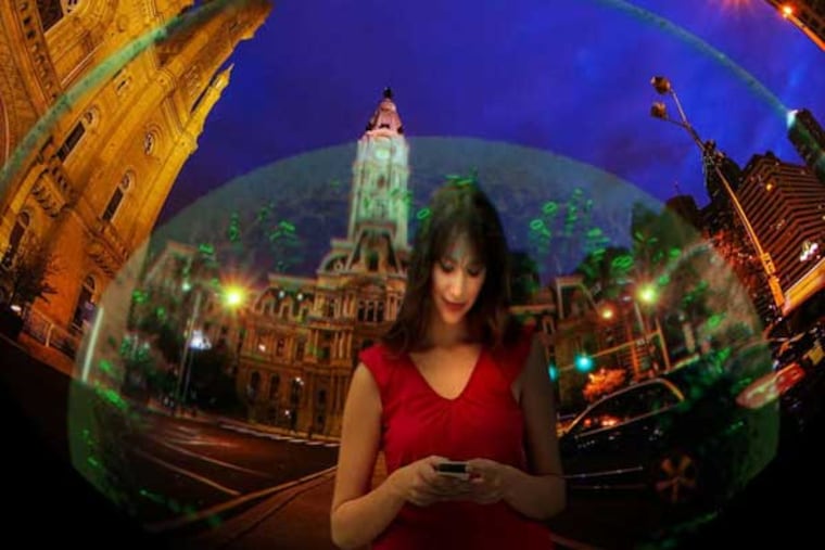 "To Space and Back" highlights benefits of space exploration. A woman uses a smartphone - which, of course, makes use of satellites.