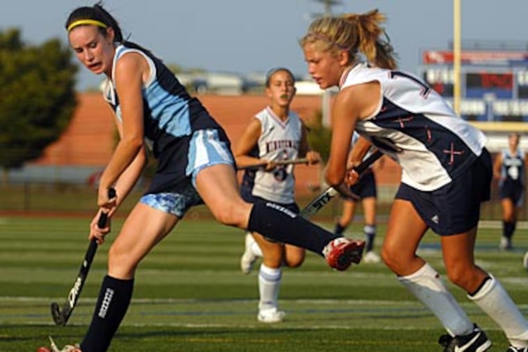 Washington Township's Kaitlyn Grabert (right) defends against Shawnee's Victoria Radwell. (Tom Gralish / Staff Photographer)