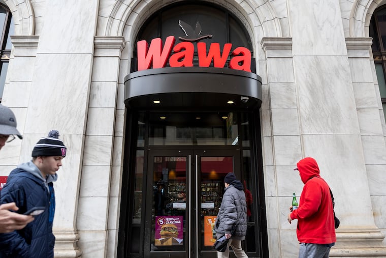 Customers enter the Wawa near Independence Mall in Philadelphia on a recent day during lunch.