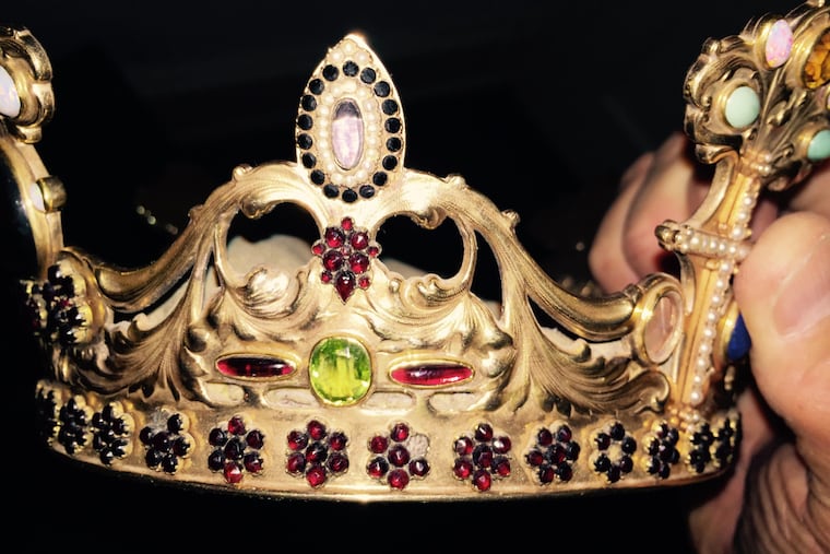 A gold and gemstone crown was stolen from the head of a marble statue of the Virgin Mary at St. John the Evangelist Church in Center City early Saturday.
