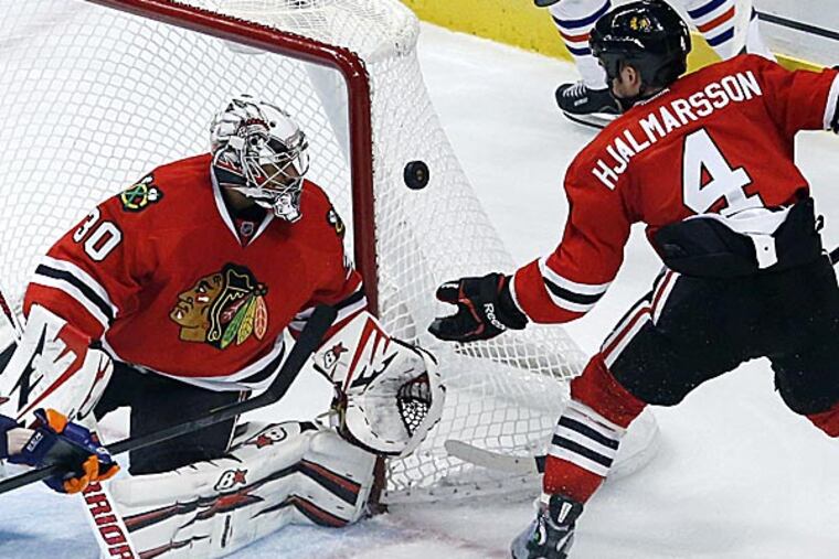The Flyers may try to bring back goaltender Ray Emery, who's now with the Blackhawks. (Charles Rex Arbogast/AP)