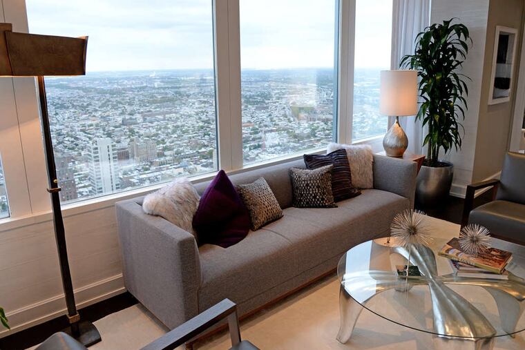 The living room in a 49th-floor unit at Two Liberty Place. The Residences at Two Liberty were carved from the upper floors in 2005. ( TOM GRALISH / Staff Photographer )