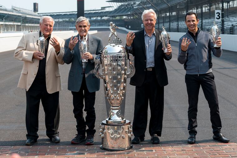 Winner of the 2021 Indy 500, Helio Castroneves, right, gathered with other four-time winners, from left, A.J. Foyt (1961, 1964, 1967, 1977), Al Unser (1970, 1971, 1978, 1987) and Rick Mears (1979, 1984, 1988, 1991) at the Indianapolis Motor Speedway in Indianapolis, Tuesday, July 20, 2021. Castroneves won the race in 2001, 2002, 2009 and 2021. Unser, one of only four drivers to win the Indianapolis 500 a record four times, died Thursday, Dec. 9, 2021, following years of health issues. He was 82.
