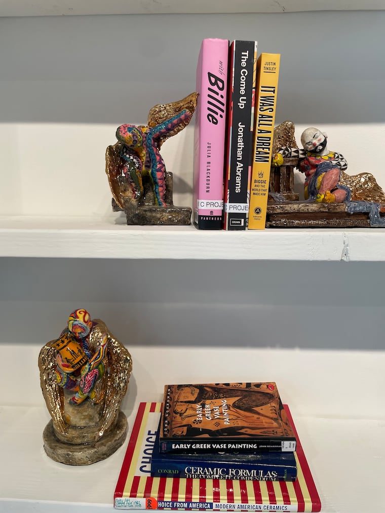Shelves of figurines by Philadelphia ceramic artist Roberto Lugo on view in "American Crib" at the Clay Studio through July 5.