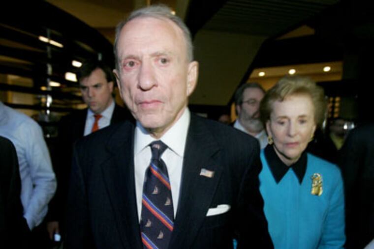 U.S. Sen. Arlen Specter, left, and his wife Joan, right, leave election night headquarters after conceding the Democratic primary election to John Sestak. ( Charles Fox / Staff Photographer )