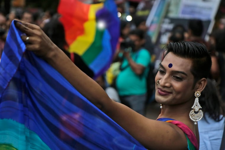 A gay rights activist participates in a rally to commemorate the twentieth anniversary of the first pride parade in the country, in Kolkata, India, Saturday, June 29, 2019.