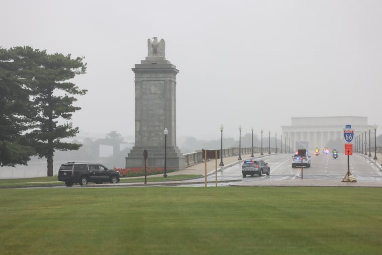President Donald Trump’s motorcade drives past the proposed location of a triumphal arch last month.