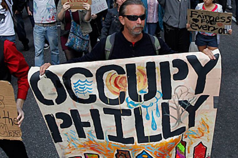 People march from City Hall to the Freedom Park near Independence Hall Saturday, Oct. 15, 2011 in Philadelphia. The demonstration at City Hall is one of many being held across the country in support of the ongoing Occupy Wall Street demonstration in New York. (AP Photo/Alex Brandon)