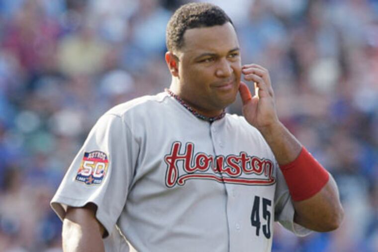 Houston Astros first baseman Carlos Lee pauses during the eighth
inning of a baseball game against the Chicago Cubs in Chicago,
Saturday, June 30, 2012. The Cubs won 3-2. (AP Photo/Nam Y. Huh)