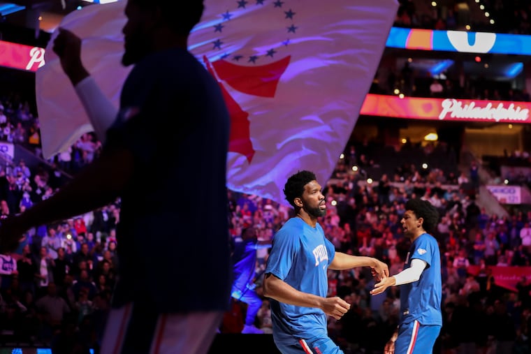 Joel Embiid is introduced before the start of a game against the Charlotte Hornets at the Wells Fargo Center in Philadelphia on Saturday.