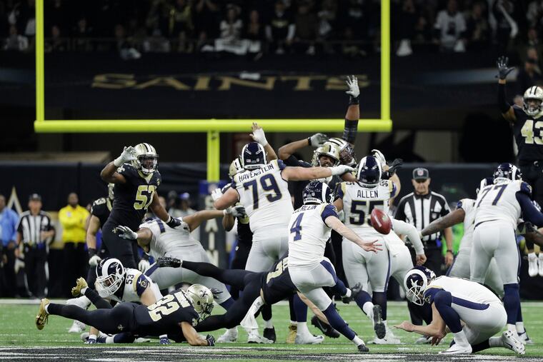 Rams kicker Greg Zuerlein kicks the game-winning field goal in overtime on Sunday.