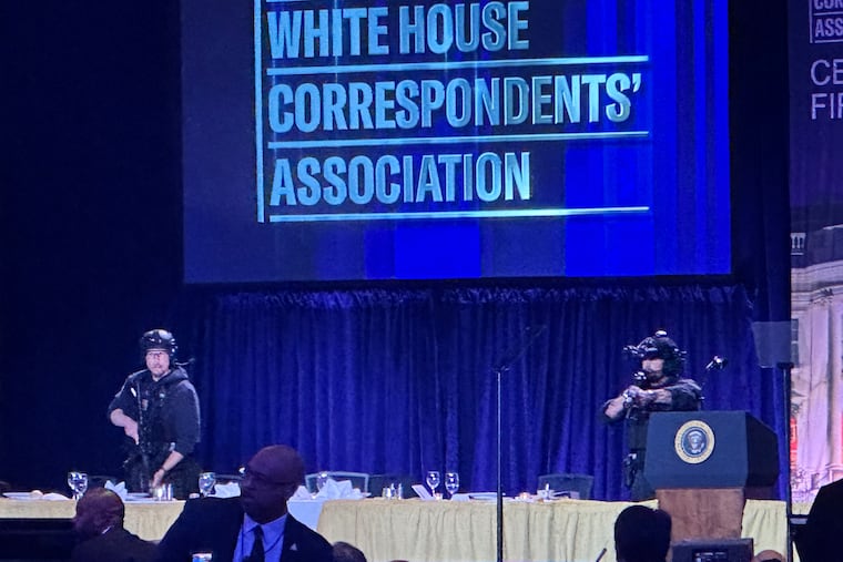 Secret Service agents respond on stage after Saturday night's attack during the White House correspondents' dinner.