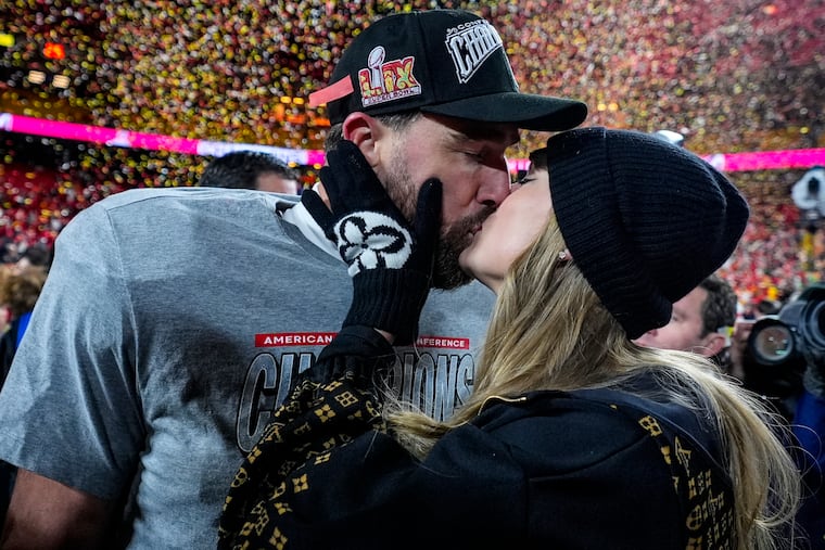 Kansas City Chiefs tight end Travis Kelce and Taylor Swift kiss after the AFC Championship NFL football game against the Buffalo Bills, Sunday, Jan. 26, 2025, in Kansas City, Mo. (AP Photo/Ashley Landis)
