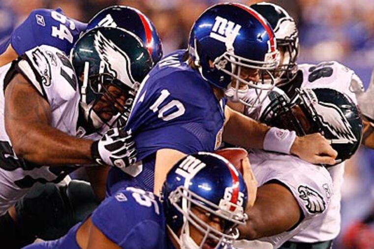 The Eagles kept Eli Manning mostly in check, and held the Giants' rushing attack to just 29 yards. (David Maialetti/Staff Photographer)