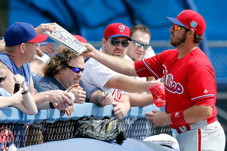J.P. Arencibia returns a book after signing his autograph.