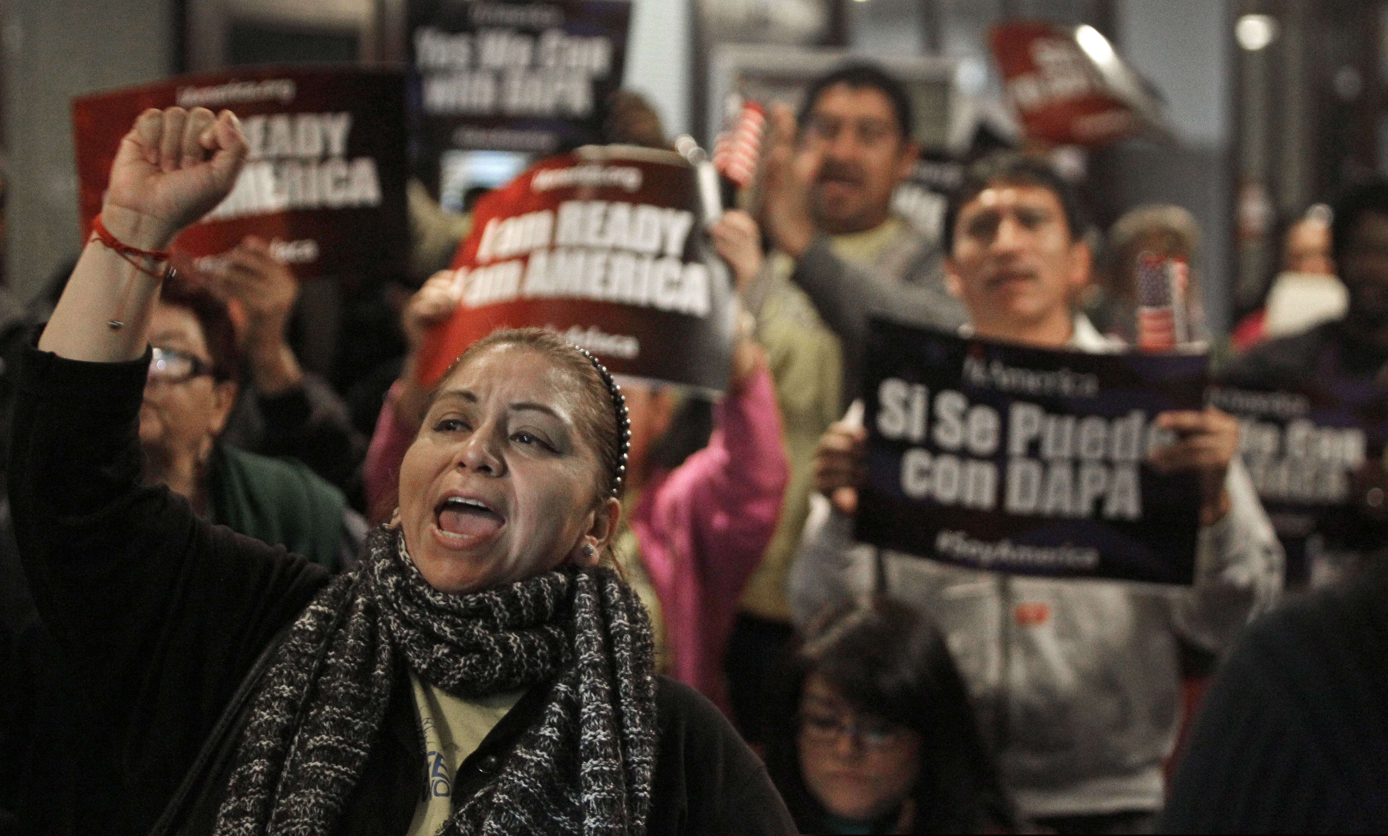 Mercedes Herrera and others chant during an event on DACA and DAPA Immigration Relief at the Houston International Trade Center in Houston. A federal judge in Texas on Friday, July 16, 2021 ordered an end to an Obama-era program that prevented the deportations of some immigrants brought into the United States as children, putting new pressure for action on President Joe Biden and Democrats who now control Congress.