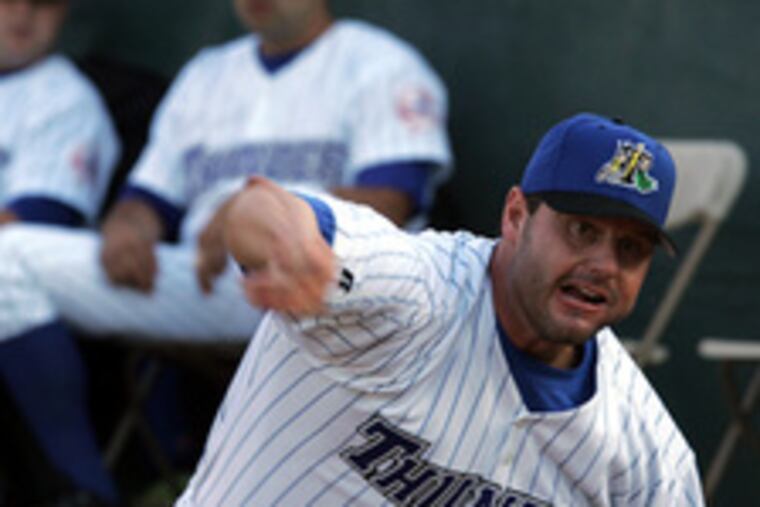 Roger Clemens warms up in the Thunder bullpen.