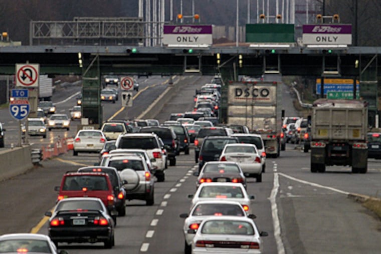 Drivers approach the toll plaza at Exit 1 of the New Jersey Turnpike, approaching the Delaware Memorial Bridge.