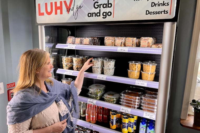 Owner Silvia Lucci at the grab-and-go refrigerator case at LUHV Vegan Bistro, 1131 S. 19th St.