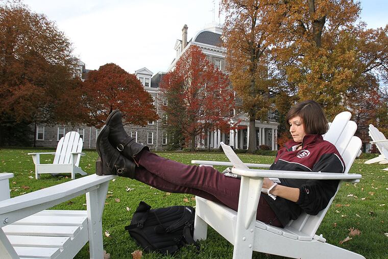 Swarthmore College is sitting on an endowment worth $1.9 billion, one of the country’s richest. Student Laura Fitzgerald relaxes on campus. CHARLES FOX / Staff Photographer