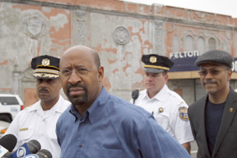 Mayor Nutter, center, pauses before speaking at a news conference Sunday outside the Felton, a nightclub in the Feltonville section of Philadelphia. (David Maialetti / Staff Photographer)