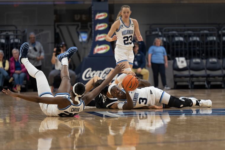 Villanova Wildcats, MD Ntambue (3) dives for a lose ball against Xavier’s Mariyah Noel (13) during the first half of an NCAA college basketball game at Villanova University, Thursday, Jan. 8, 2026, in Villanova, Pa.