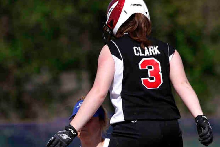 Archbishop Carroll's Monica Clark is safe at second as Conwell-Egan's Regina Milburn comes up with a late tag. Carroll posted an 8-1 victory to remain undefeated at 7-0.