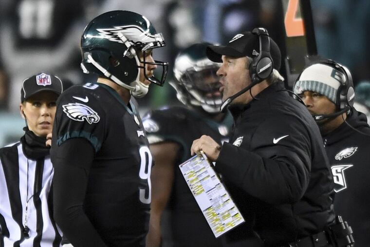 Philadelphia Eagles coach Doug Pederson (right) and quarterback Nick Foles (left).