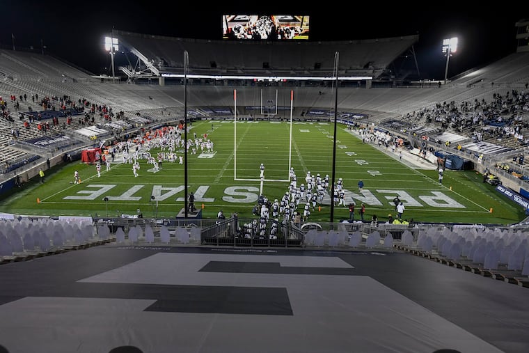 Penn State and Ohio State players taking the field Saturday night.