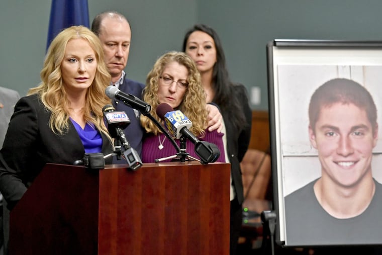 Centre County District Attorney Stacy Parks Miller, left, announces the findings of an investigation into the death of Penn State student Tim Piazza, as his parents, Jim and Evelyn Piazza, stand nearby.
