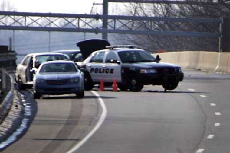 The accident scene on U.S. Route 1 North at the I-95 interchange in Langhorne where a police officer was struck and killed during a traffic stop Thursday morning. (Laurence Kesterson / Staff Photographer)