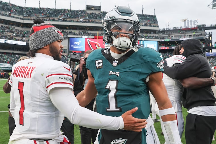 Eagles quarterback Jalen Hurts talks with Arizona Cardinals quarterback Kyler Murray after the defeat at Lincoln Financial Field.