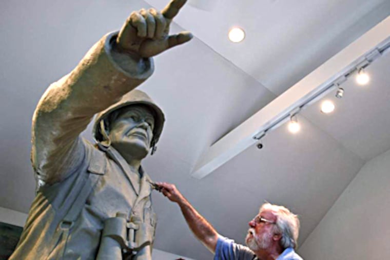Newtown Square sculptor Terry Jones works on his depiction of Marine Lt. Gen. Lewis Burwell "Chesty" Puller. Jones called Puller, who received five Navy Crosses, "a Marine's Marine." MICHAEL S. WIRTZ / Staff Photographer