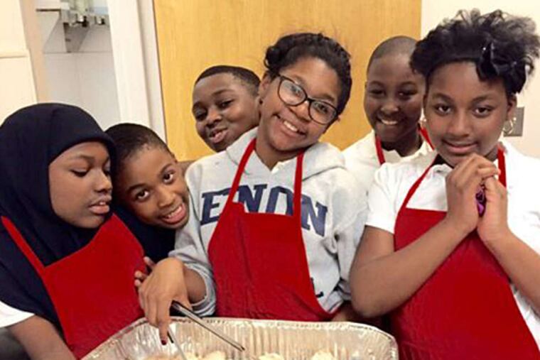 Nyla Richards (left), Amir Johnson, Monta Carter, Brianna Ketter, Reuben Smith, Lillie Williams at Community Partnership. (AMY STEINBERG)